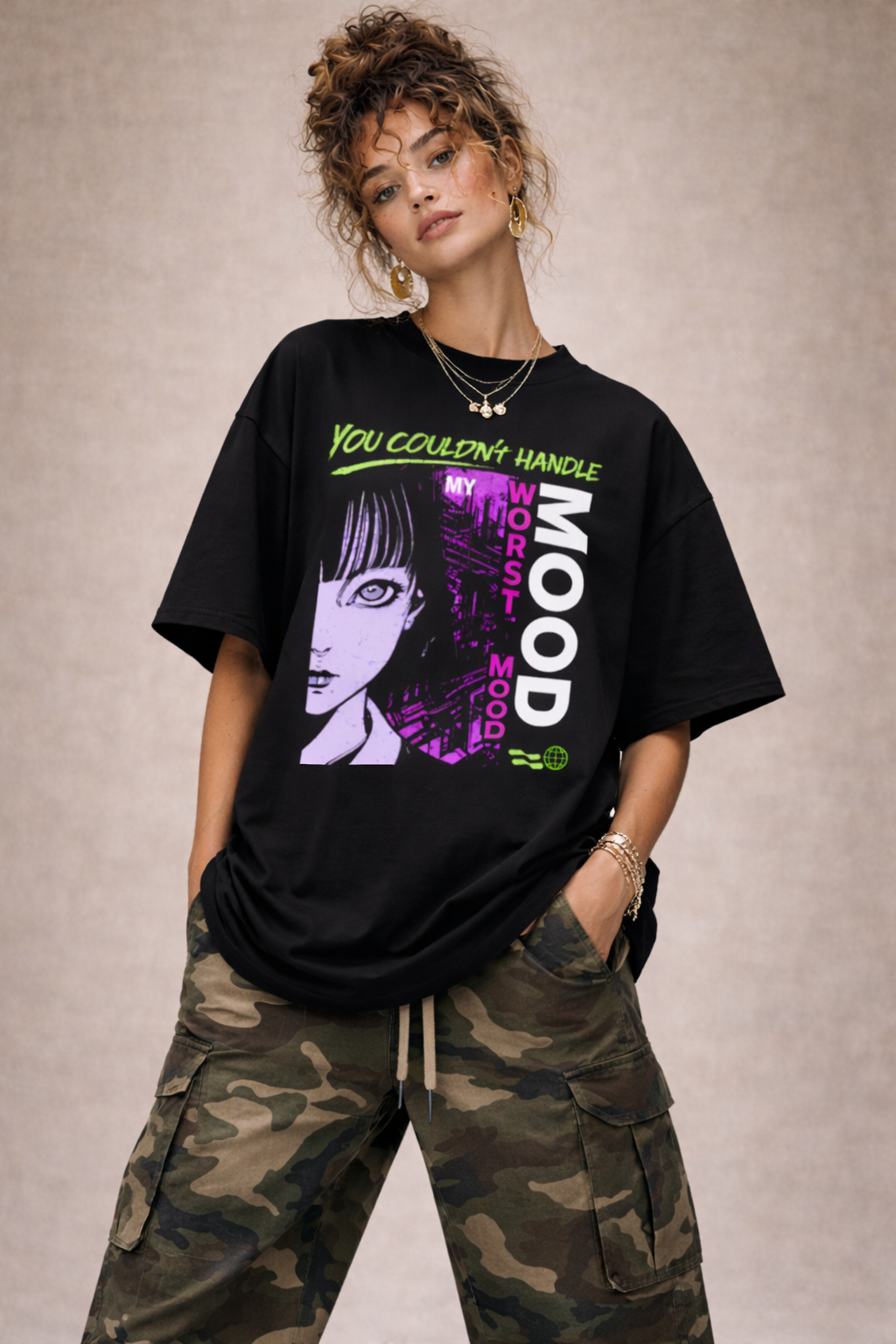 Woman wearing oversized black graphic t-shirt with neon green and purple “You Couldn’t Handle My Worst Mood” print and illustrated portrait design, bold women’s streetwear outfit.