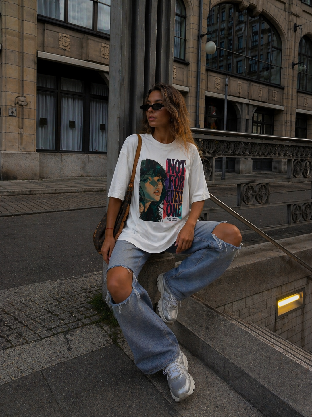 model sitting pose wearing oversized white graphic t-shirt not for everyone design streetwear fashion