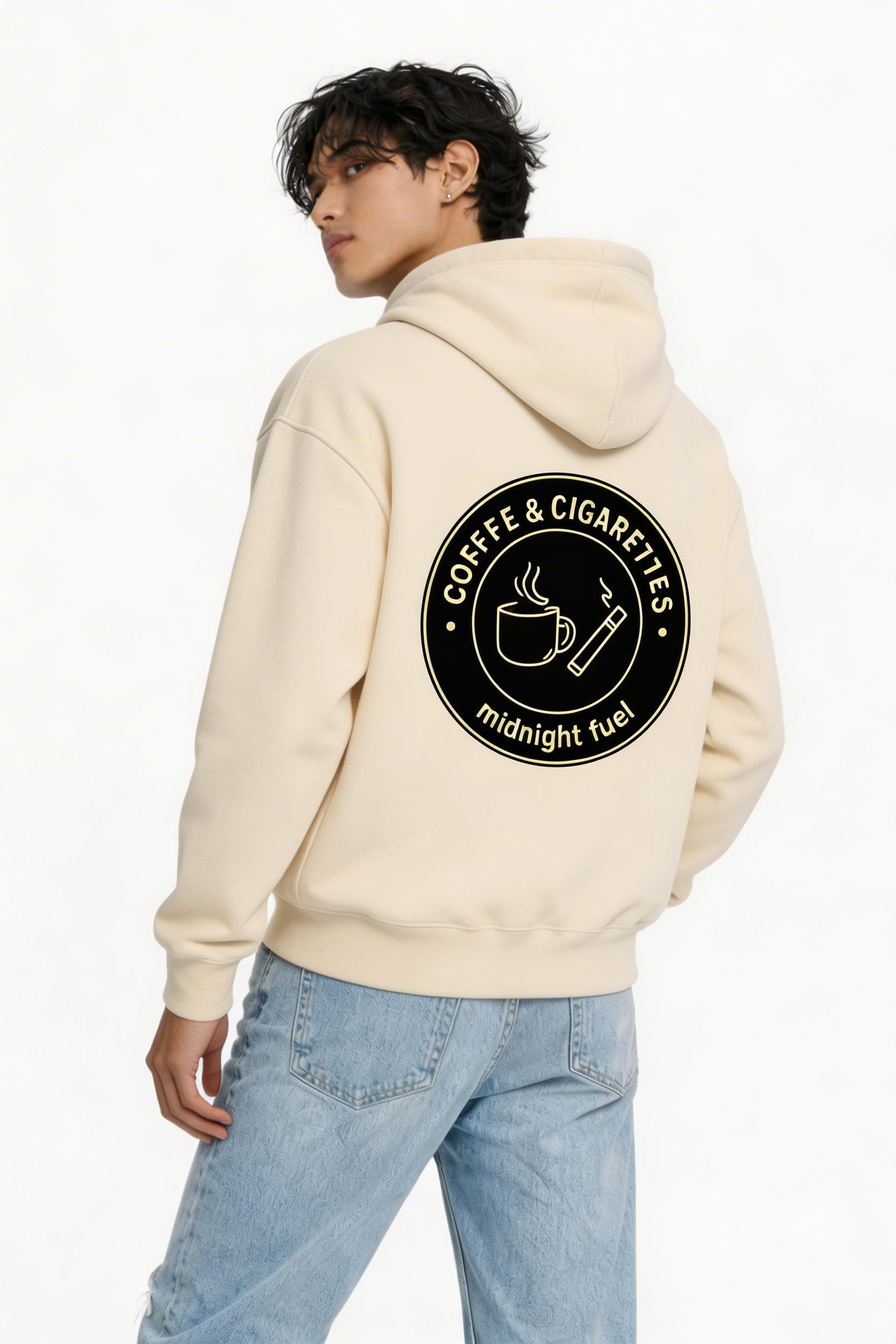 male model turning pose wearing oversized beige graphic streetwear hoodie noiré circular logo streetwear fashion