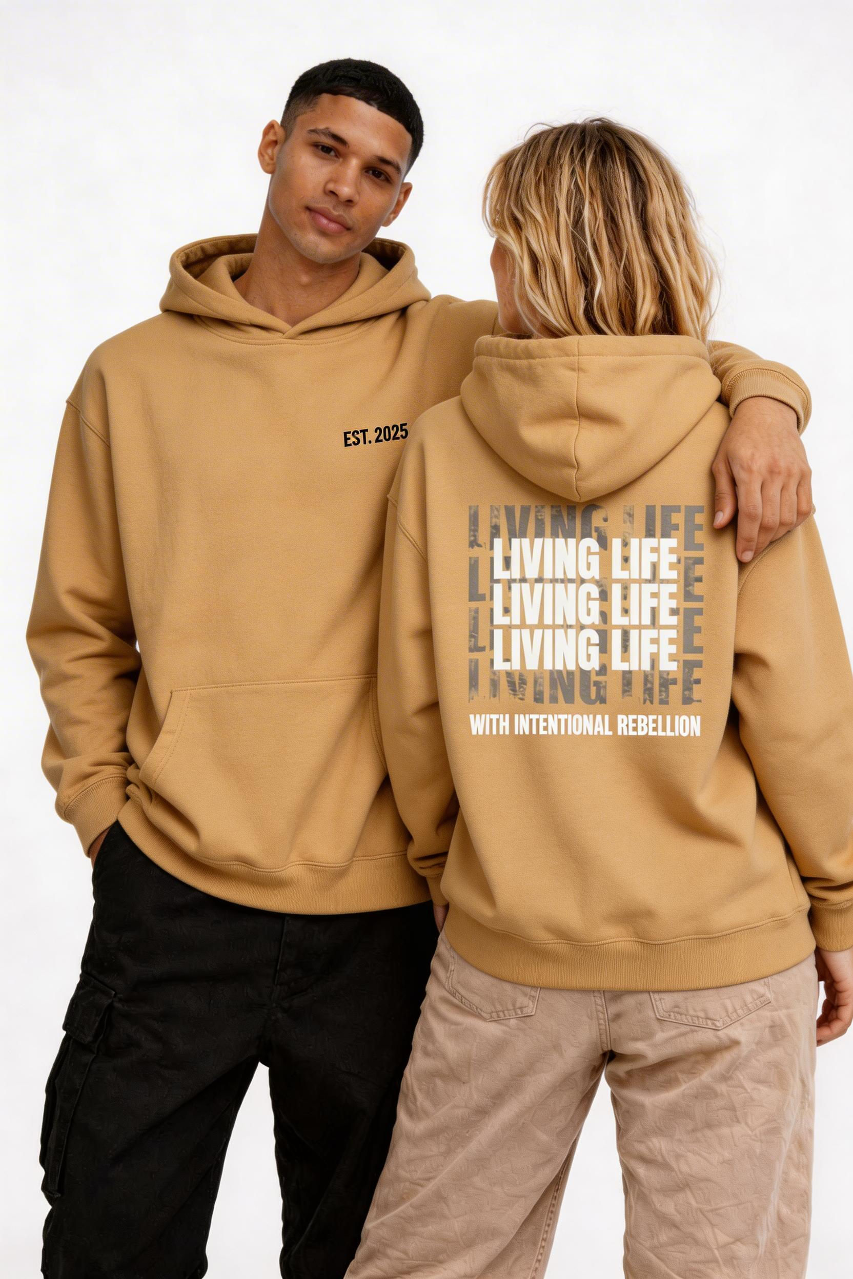 male and female models relaxed pose wearing oversized brown streetwear hoodie noiré est 2025 branding and back print graphic urban streetwear clothing