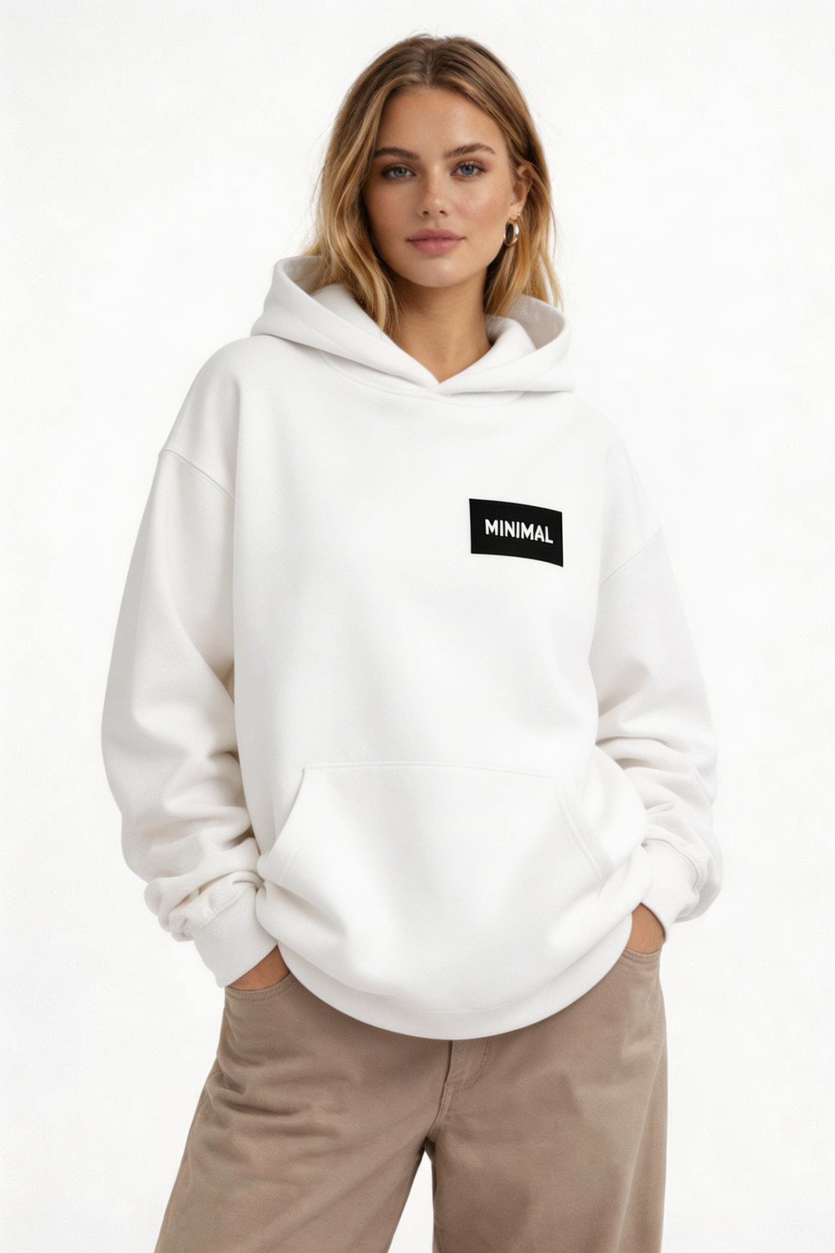female model front pose wearing oversized white basic hoodie minimal logo design streetwear outfit