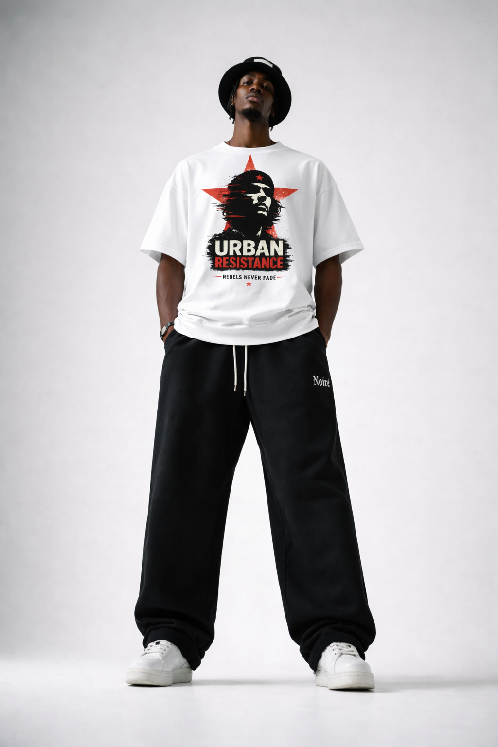 male model front pose wearing white oversized graphic t-shirt urban design modern streetwear fashion look