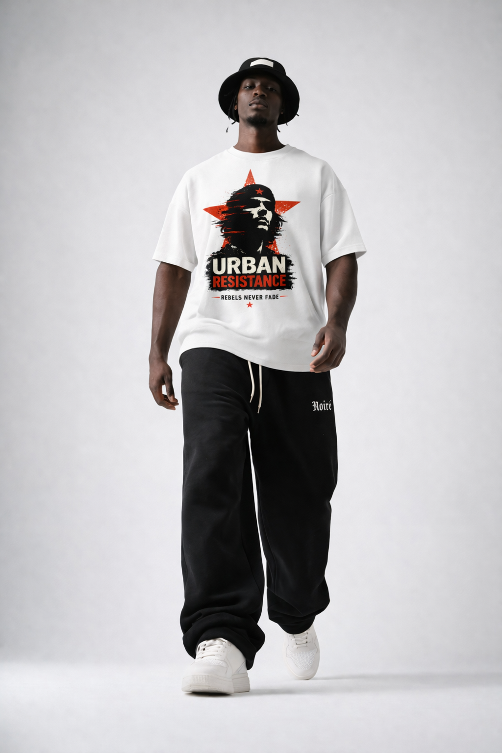 male model wearing white oversized graphic t-shirt urban resistance print modern streetwear look