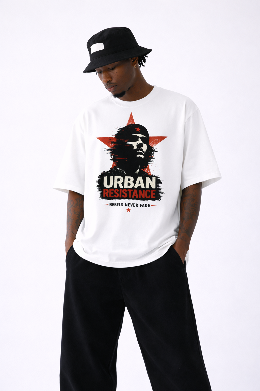 male model looking down wearing oversized white graphic t-shirt urban resistance artwork streetwear fashion