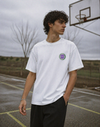 male model walking on basketball court wearing relaxed white streetwear tee 90s era graphic urban streetwear fashion