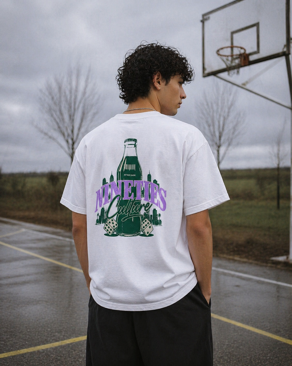 male model back view wearing oversized white graphic t shirt nineties culture retro bottle design urban streetwear outfit