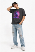 Male model posing in oversized black streetwear graphic t shirt featuring neon cyber statue futuristic artwork