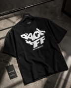 flat lay angled view oversized black graphic t shirt back off design urban streetwear outfit