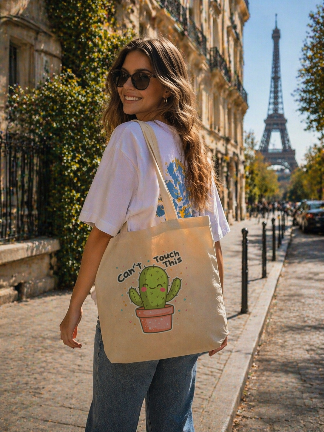 model walking back view wearing beige tote bag cactus graphic design urban streetwear outfit