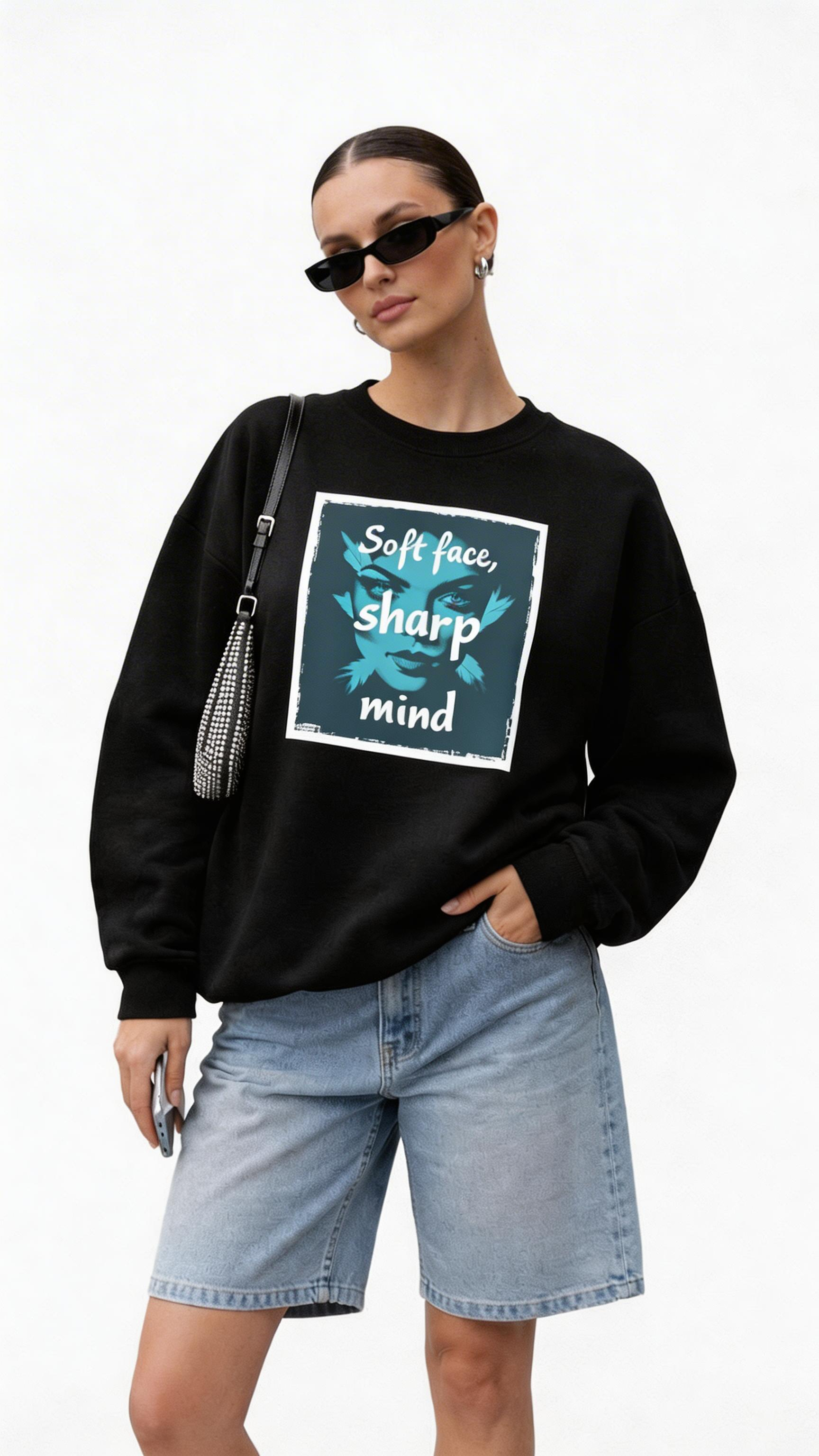 female model close up wearing oversized black sweatshirt soft face sharp mind graphic print modern streetwear outfit