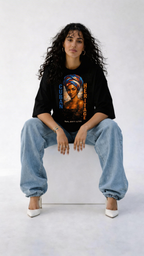 female model relaxed pose wearing black oversized graphic t-shirt artistic portrait design streetwear outfit