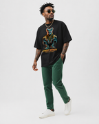 model side walking view wearing oversized black graphic t shirt with street royalty cyber animal artwork graphic streetwear