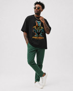model pose wearing relaxed fit black streetwear t shirt with futuristic street royalty print urban streetwear fashion