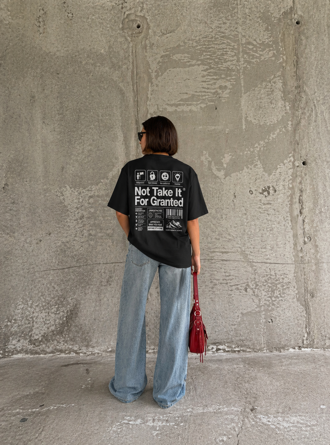 back view model wearing oversized black graphic t-shirt not take it for granted graphic streetwear