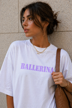 close up model wearing oversized white ballerina graphic t-shirt with pastel purple front print urban streetwear outfit