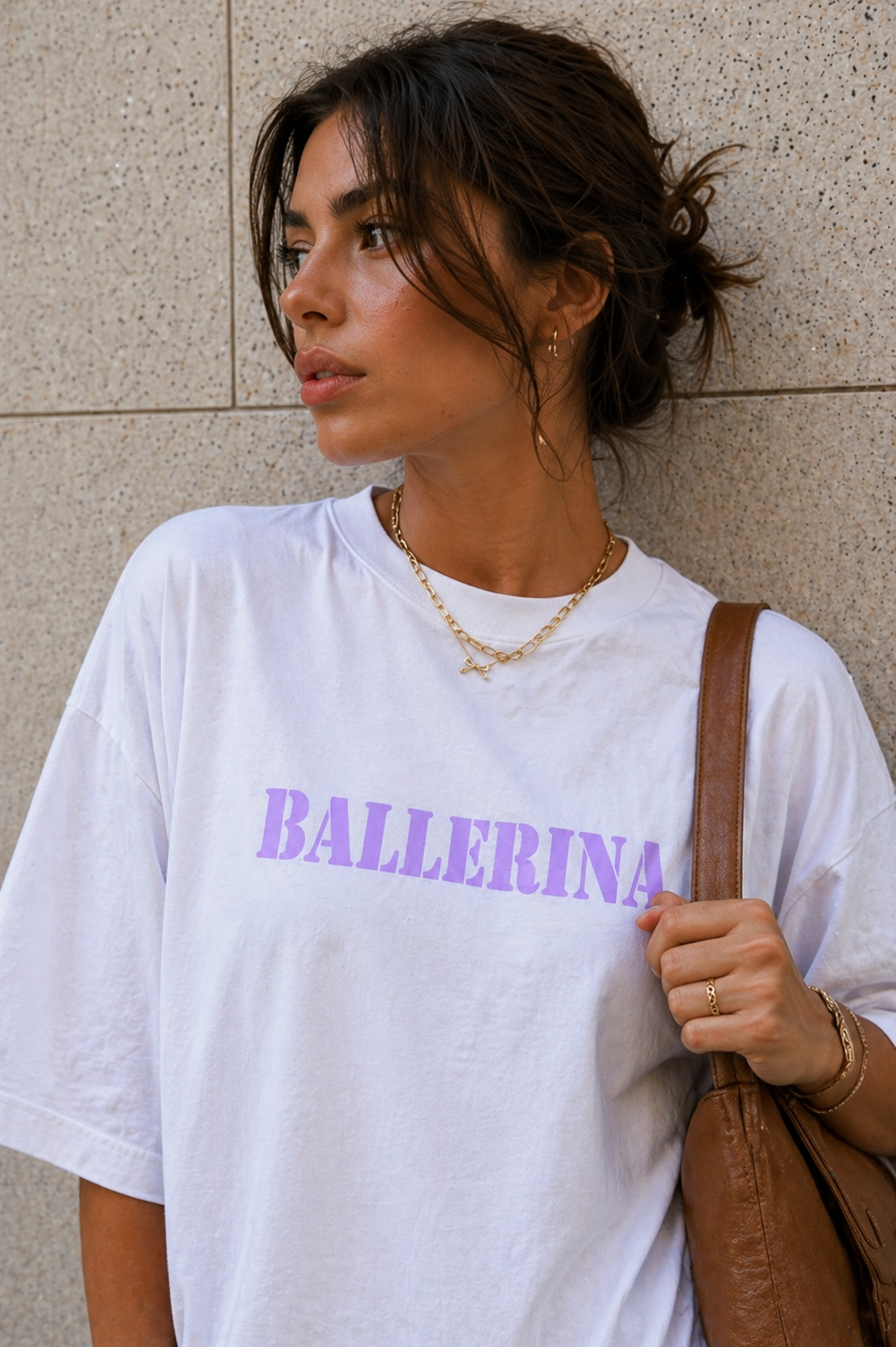 close up model wearing oversized white ballerina graphic t-shirt with pastel purple front print urban streetwear outfit