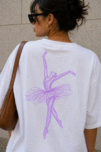 close up model wearing oversized white ballerina graphic t-shirt with pastel purple ballerina back print and sunglasses streetwear fashion