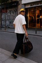 male model back view wearing oversized white t shirt with clean blank back and relaxed fit streetwear fashion