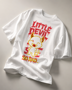 oversized white graphic t shirt laid flat featuring little devil cartoon artwork with bold red typography and relaxed streetwear aesthetic