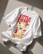 white oversized graphic streetwear t shirt with little devil character print and statement typography photographed in soft natural light