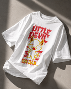 relaxed fit white graphic t shirt displaying little devil cartoon design with bold red and yellow artwork streetwear fashion