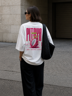 model back view wearing oversized white graphic t shirt pitaya exotic dragon fruit print urban streetwear outfit