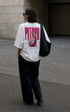 model walking back view wearing oversized white graphic t shirt pink pitaya graphic urban streetwear outfit