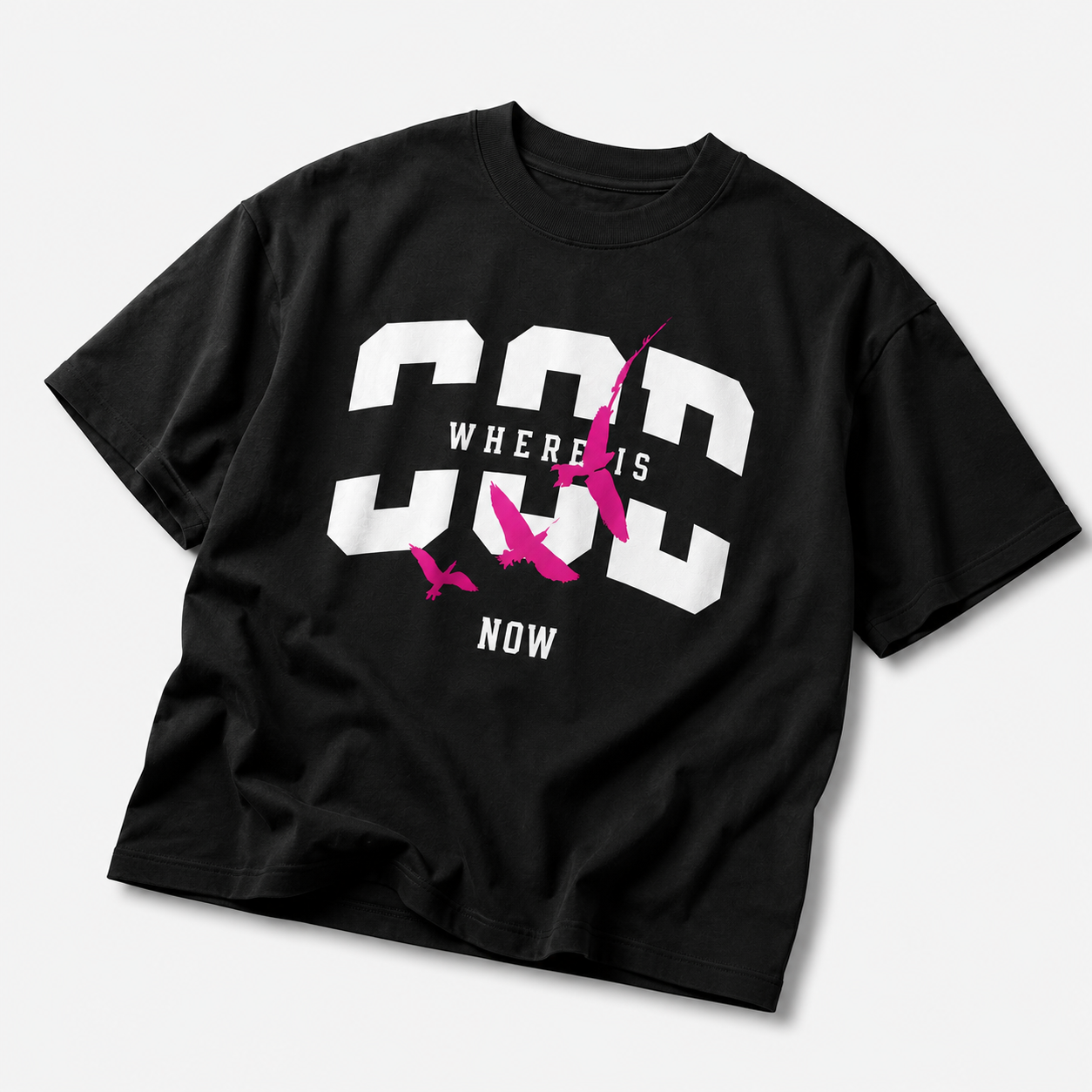 angled view oversized black graphic t shirt featuring pink bird graphic and bold typography graphic streetwear apparel