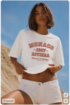 model front close up lifting oversized white graphic t shirt monaco riviera graphic streetwear fashion