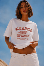 model front close up wearing oversized white graphic t shirt monaco riviera design beach streetwear fashion