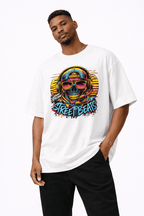 male model standing pose wearing oversized white graphic t shirt neon skull street art design urban streetwear outfit
