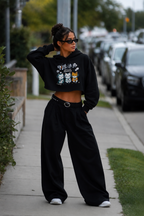 model standing pose wearing black cropped hoodie kawaii graphic urban streetwear outfit