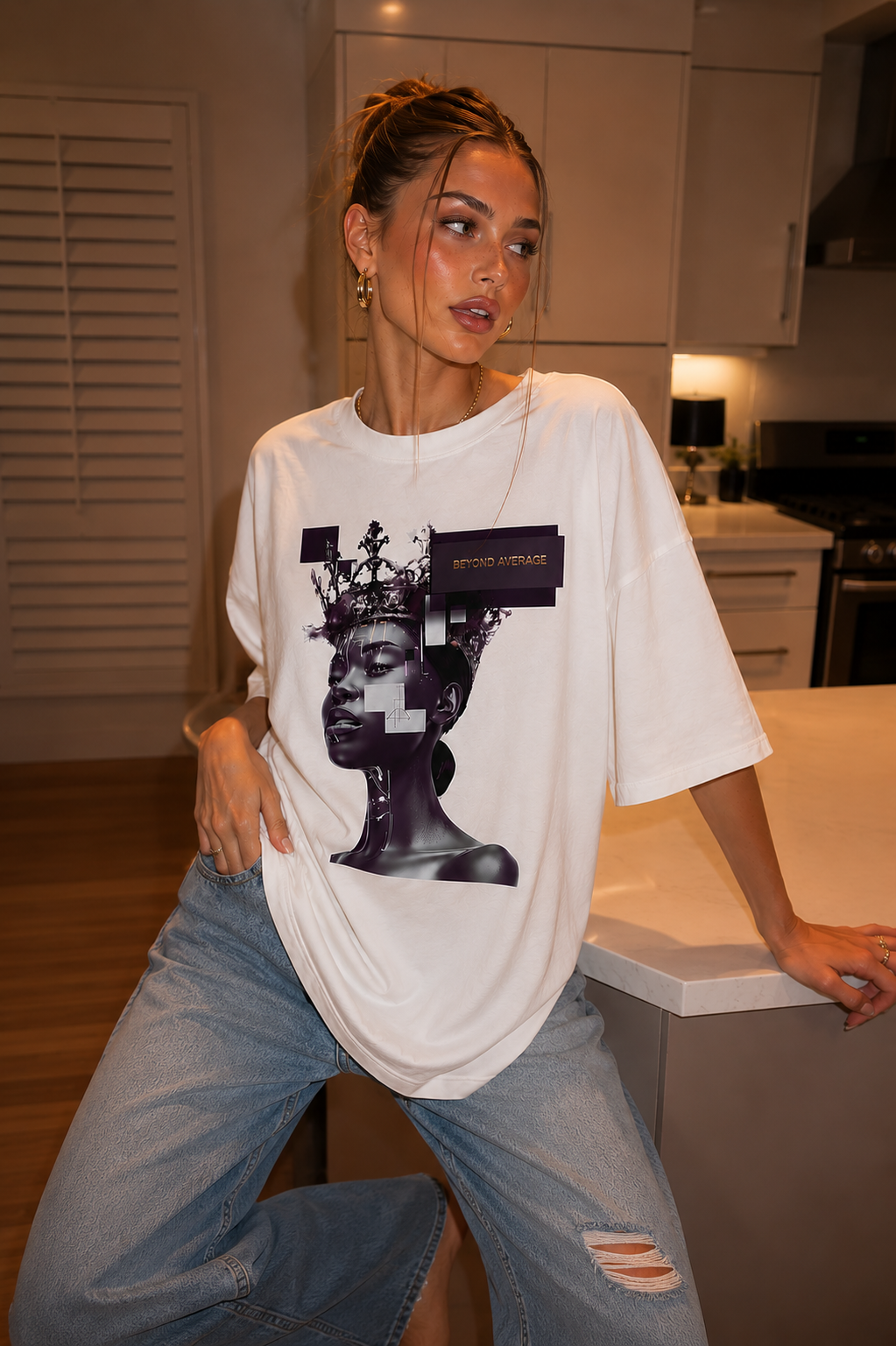 woman posing beside kitchen island wearing oversized white graphic t shirt futuristic queen graphic urban streetwear outfit