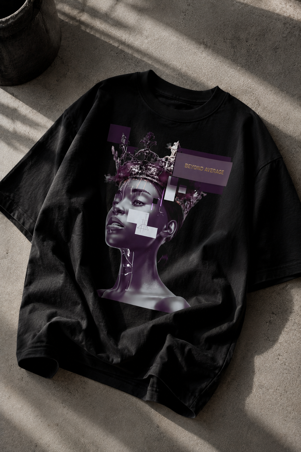 oversized black graphic t shirt angled flat lay with futuristic queen portrait design urban streetwear outfit