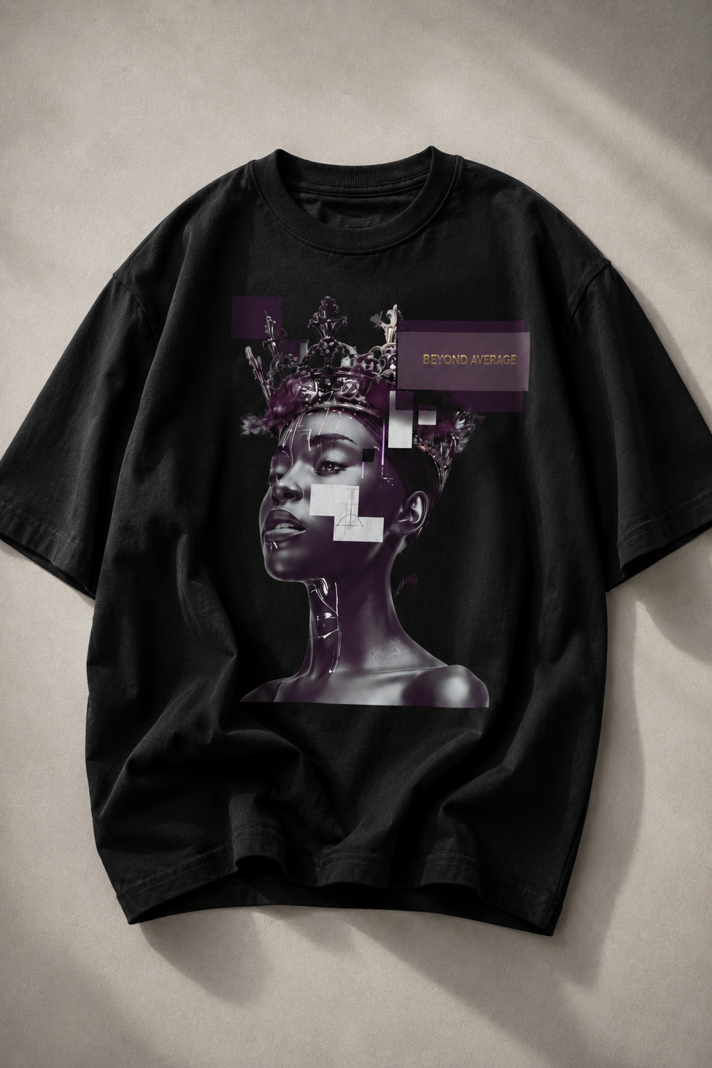 oversized black graphic t shirt flat lay on stone surface featuring beyond average cyber queen artwork graphic streetwear