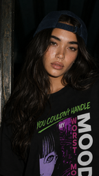 close up model portrait wearing oversized black graphic t shirt purple anime graphic streetwear fashion