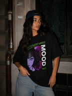 model standing pose wearing oversized black graphic t shirt anime inspired graphic streetwear fashion