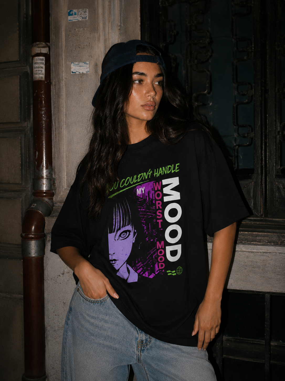 model standing pose wearing oversized black graphic t shirt anime inspired graphic streetwear fashion
