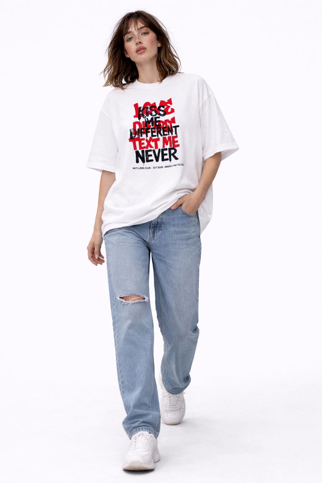 Woman wearing oversized white streetwear graphic t-shirt featuring Text Me Never statement design