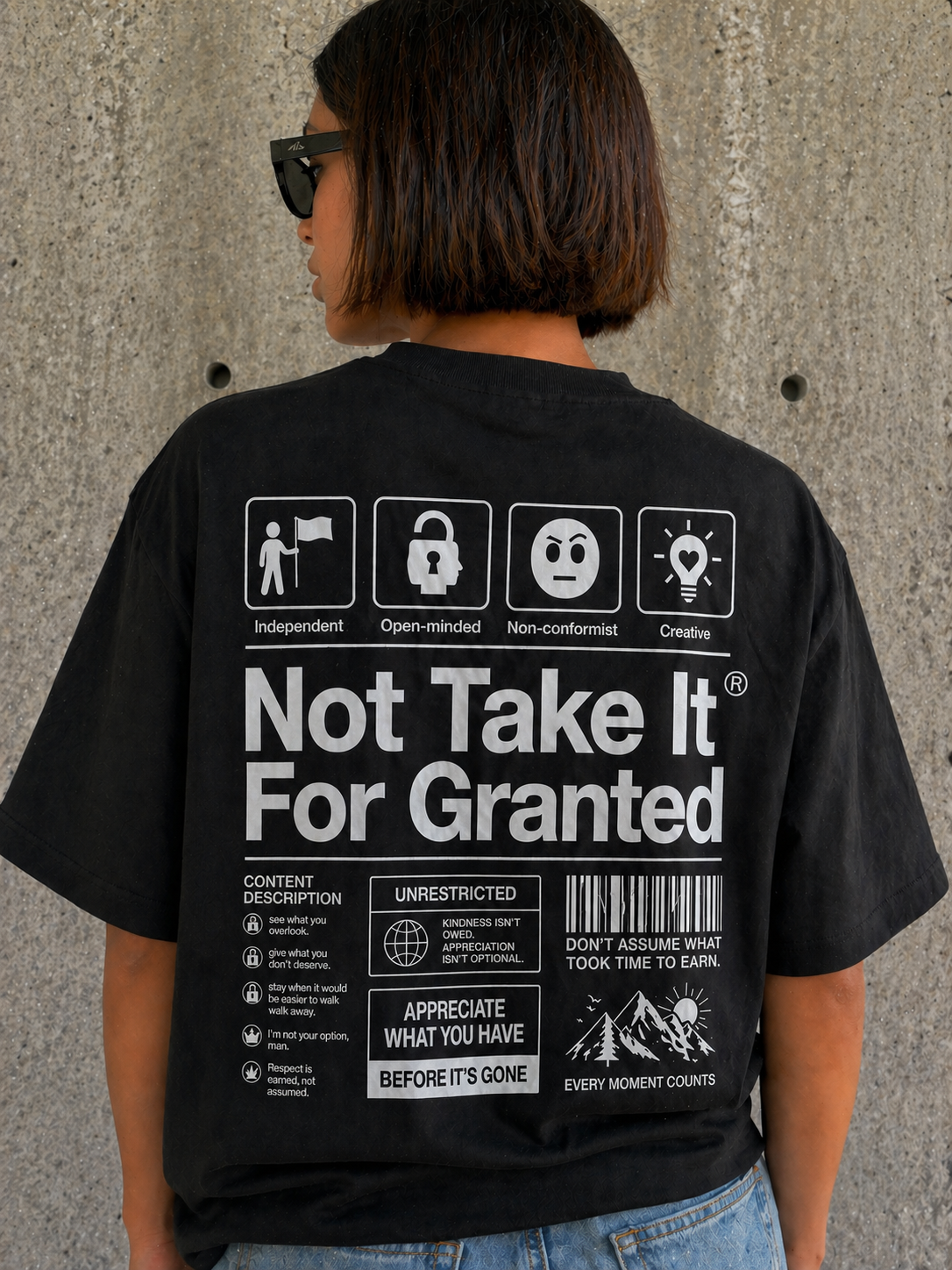 back detail model wearing oversized black graphic t-shirt statement back print graphic streetwear