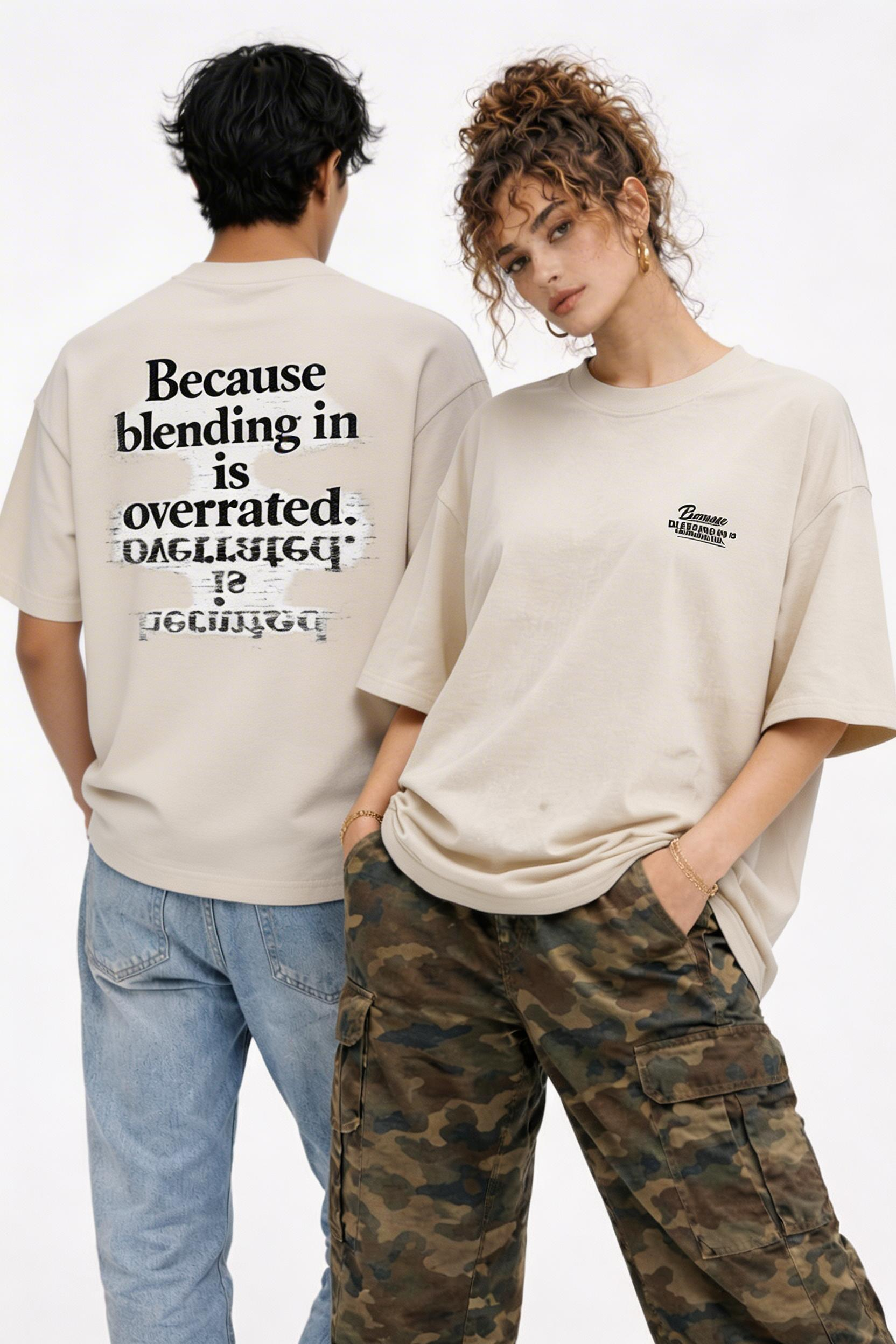 male and female models wearing oversized beige streetwear graphic t-shirt because blending in is overrated statement streetwear outfit