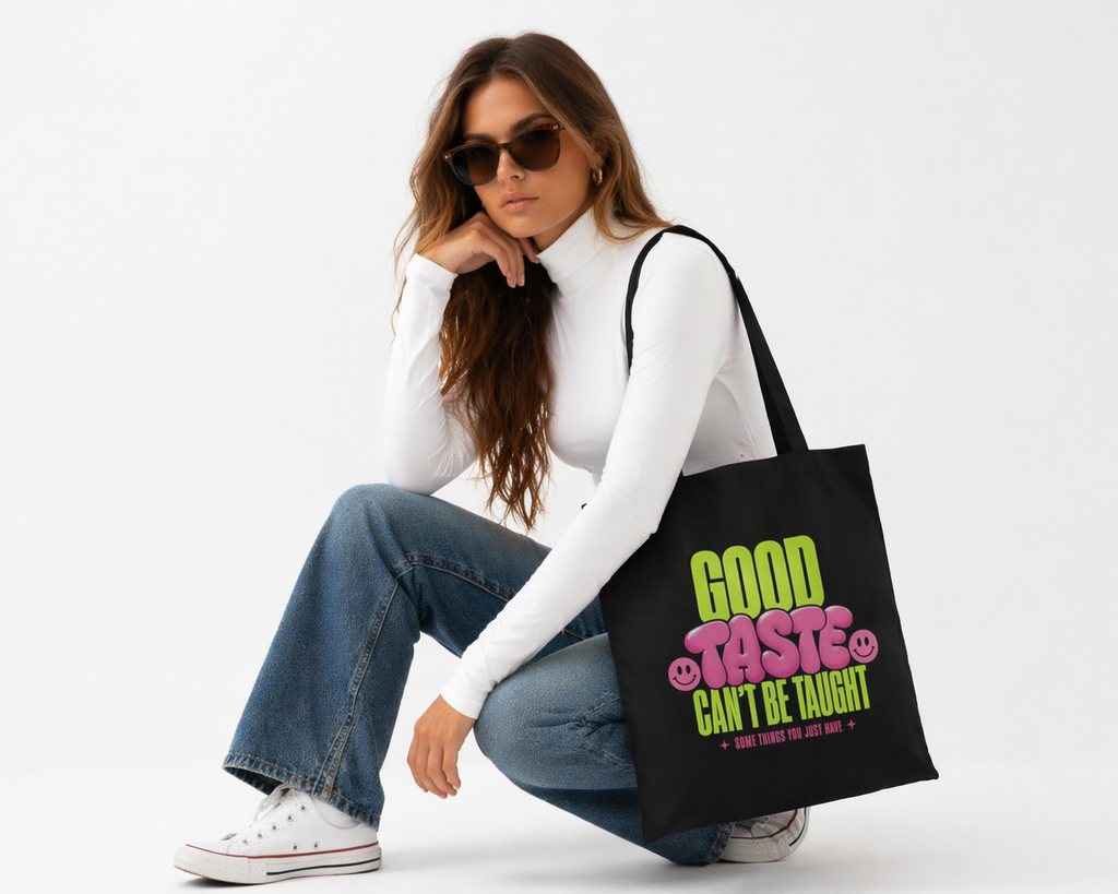 model seated angled view wearing oversized black tote bag good taste attitude design streetwear fashion