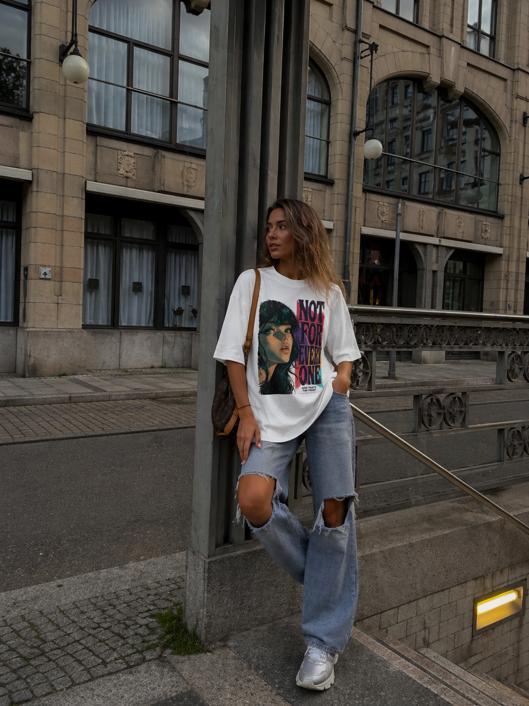 model standing pose wearing oversized white graphic t-shirt not for everyone graphic urban streetwear outfit