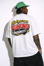 male model back view wearing oversized white graphic streetwear t shirt mind your own fucking business typography graphic urban streetwear outfit
