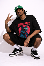 male model wearing oversized black graphic streetwear t-shirt with badass cat artwork