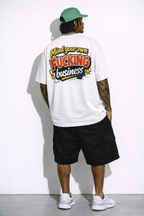 male model full body back view wearing oversized white graphic streetwear t shirt mind your own fucking business back print streetwear fashion