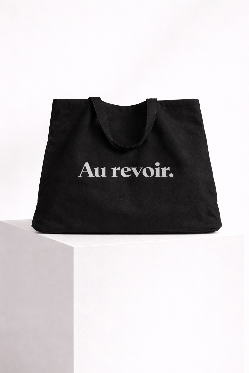 product front view black tote bag au revoir typography design streetwear fashion