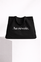 product front view black tote bag au revoir typography design streetwear fashion