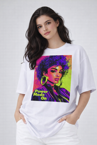 Female model wearing white oversized t-shirt with neon pop-art portrait print, vibrant streetwear style by Noiré.
