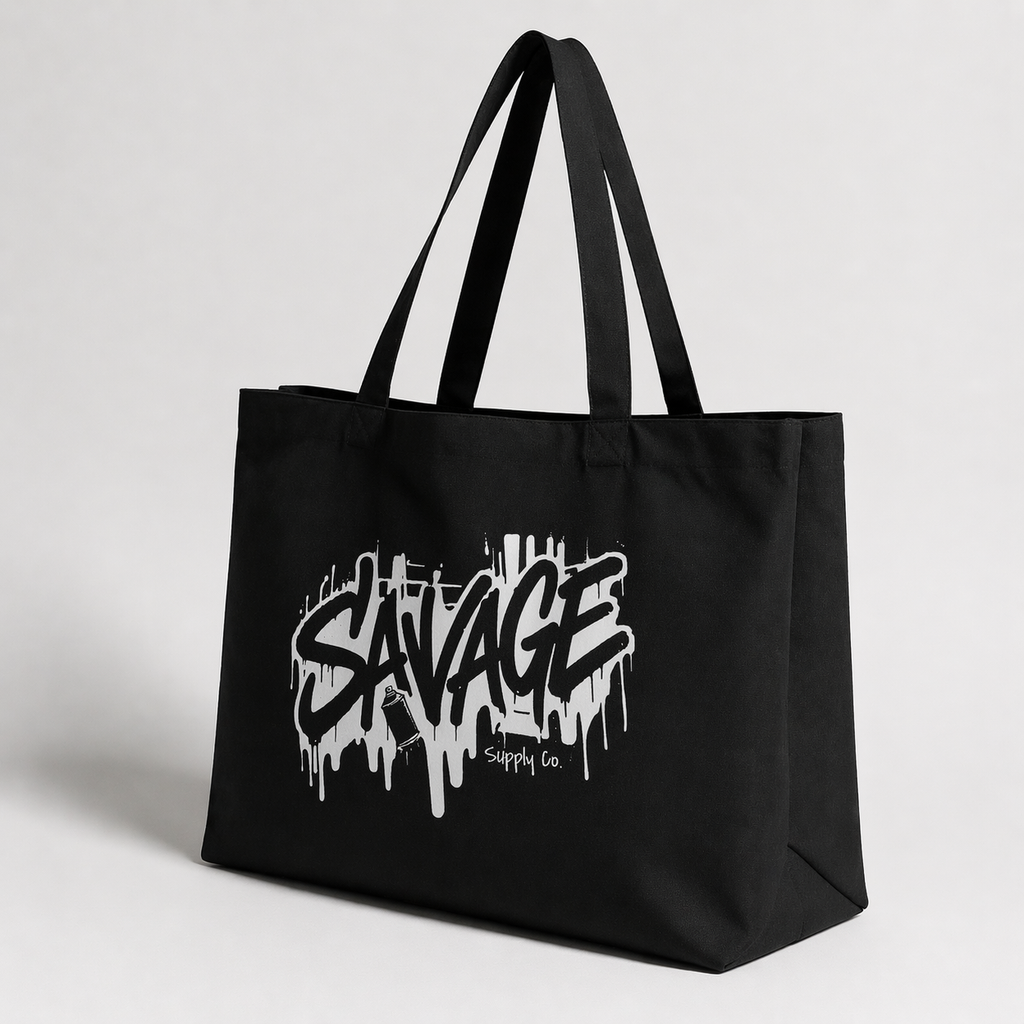 product angled view black tote bag savage logo minimal studio graphic streetwear